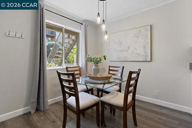 a view of a dining room with furniture window and outside view