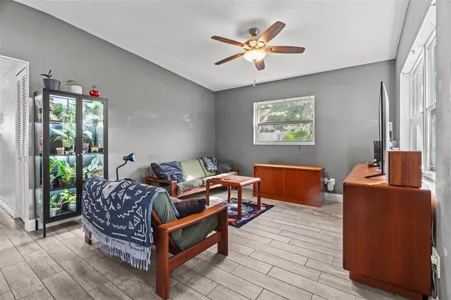 a bedroom with furniture and wooden floor