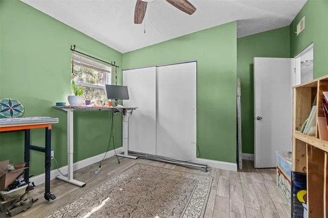 a view of kitchen with refrigerator and window
