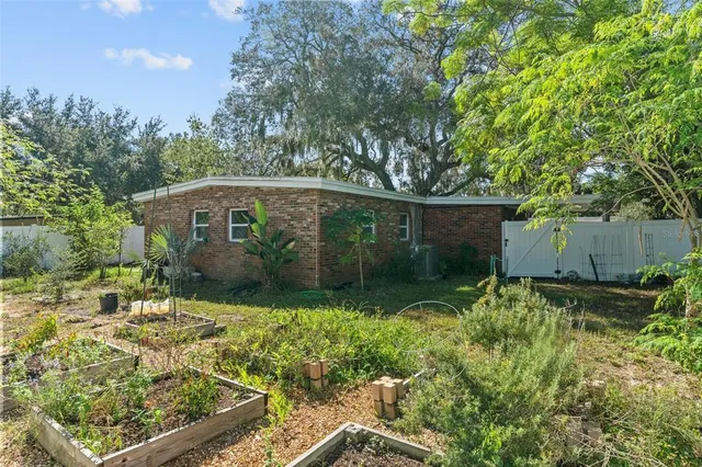 a backyard of a house with lots of green space