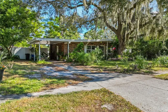 a front view of house with yard and green space