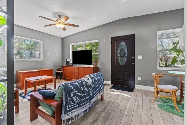 a living room with furniture and a flat screen tv