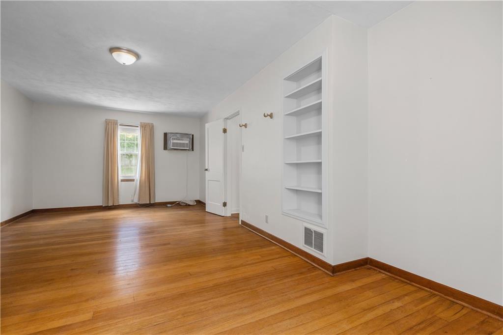 1580 Brush Run Road Washington, PA 15301 - Photo 22 of 27 a view of an empty room with wooden floor and windows