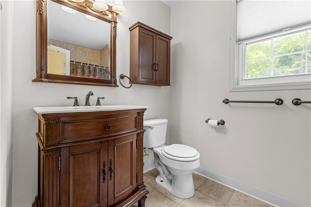 1580 Brush Run Road Washington, PA 15301 - Photo 24 of 27 a bathroom with a toilet sink and mirror