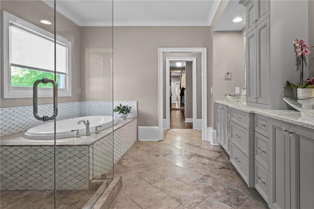 490 Belada Boulevard Atlanta, GA 30342 - Photo 19 of 42 a bathroom with sink shower and bathtub