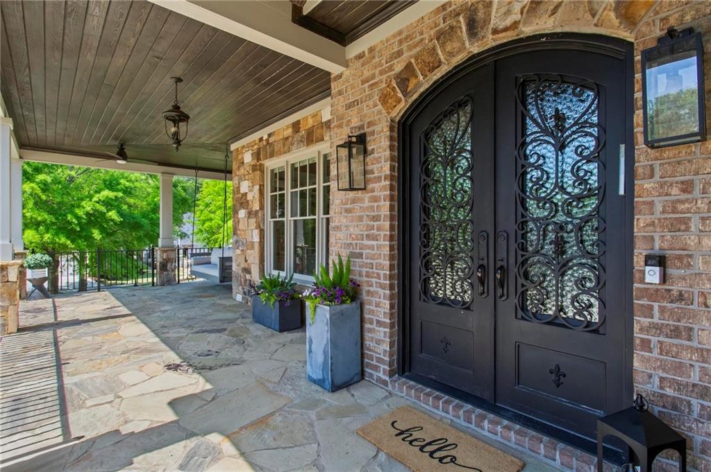 490 Belada Boulevard Atlanta, GA 30342 - Photo 2 of 42 a front view of a house with garden
