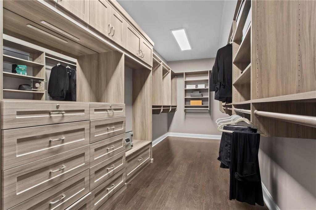 490 Belada Boulevard Atlanta, GA 30342 - Photo 22 of 42 a view of walk in closet with clothes and shoes