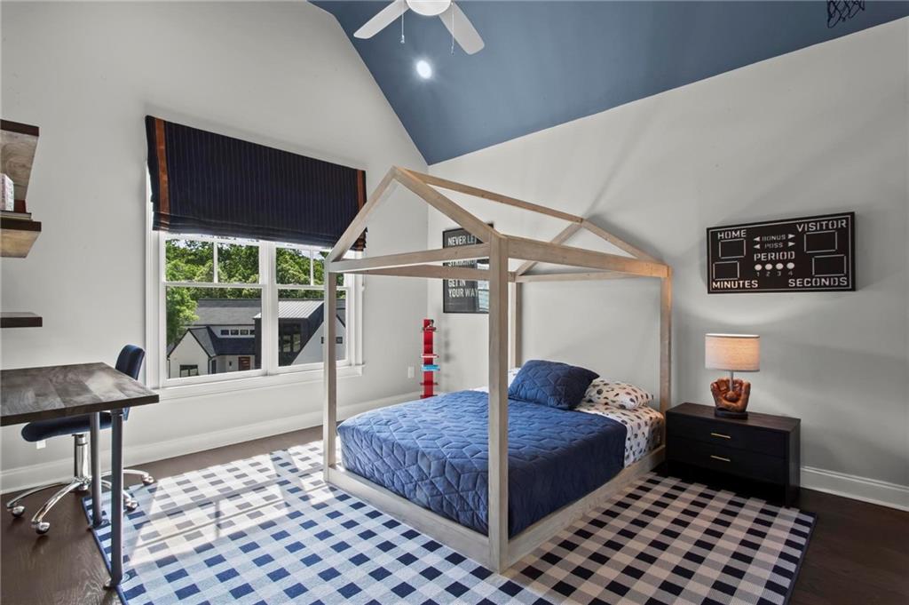 490 Belada Boulevard Atlanta, GA 30342 - Photo 23 of 42 a bedroom with a bed and a window