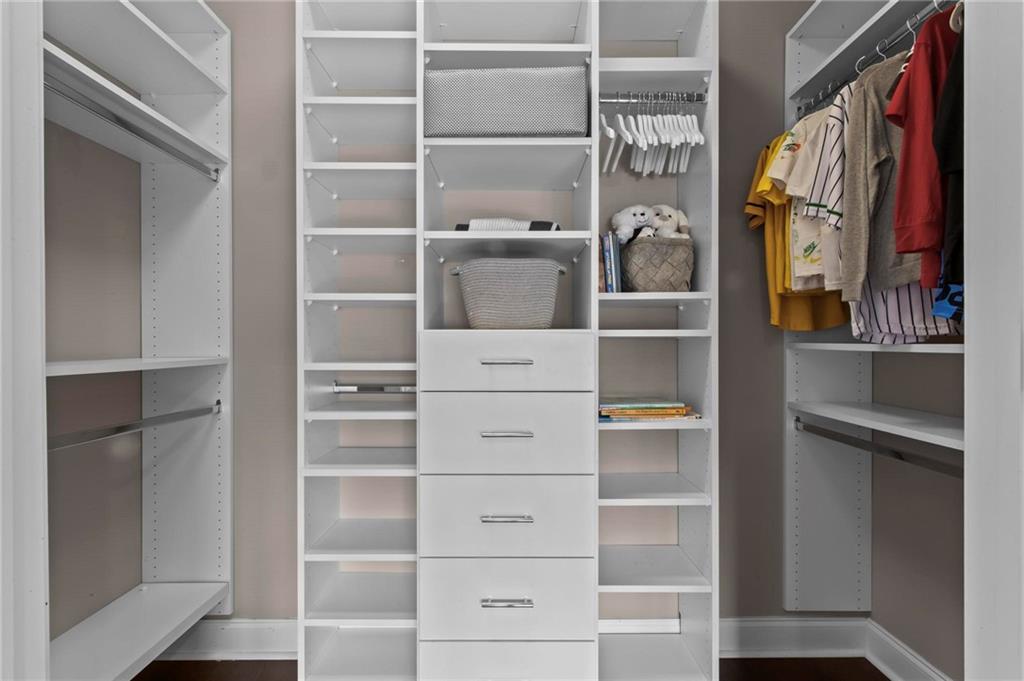 490 Belada Boulevard Atlanta, GA 30342 - Photo 25 of 42 a view of walk in closet with empty racks