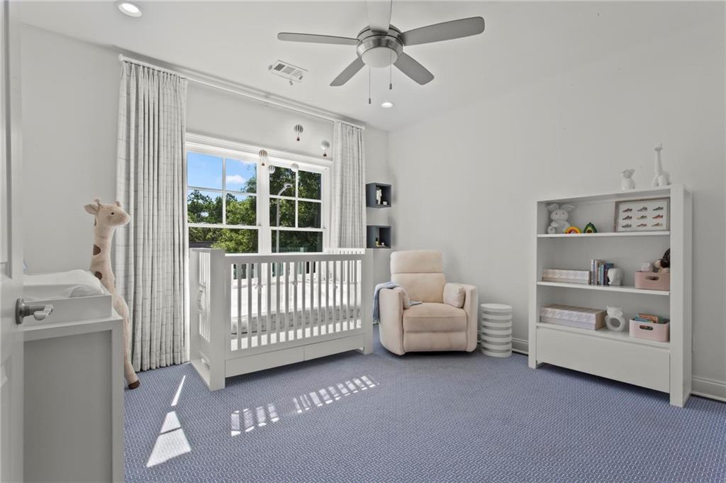 490 Belada Boulevard Atlanta, GA 30342 - Photo 26 of 42 a bedroom with furniture and a window