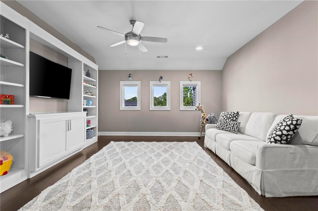 490 Belada Boulevard Atlanta, GA 30342 - Photo 30 of 42 a living room with furniture and a flat screen tv