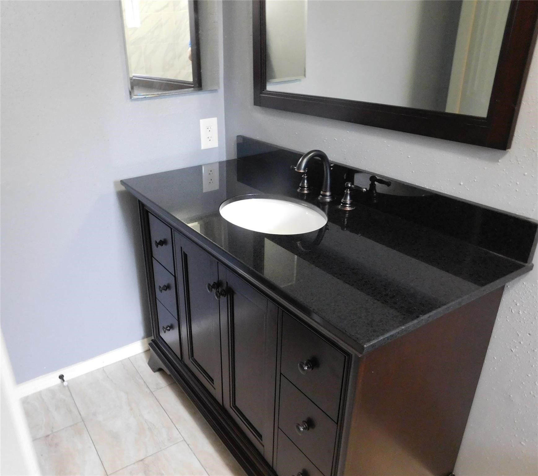 22314 Falvel Drive Spring, TX 77389 - Photo 8 of 12 a bathroom with a sink and a mirror
