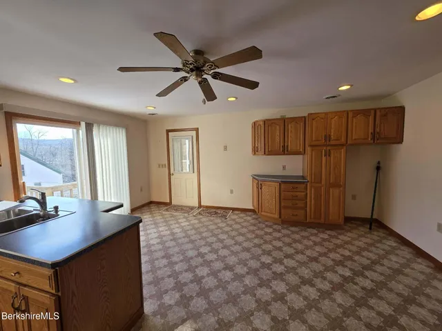 a living room with a couch and a window