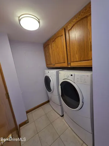 a view of bathroom with washer and dryer