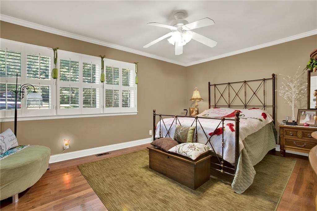 103 Mims Drive Calhoun, GA 30701 - Photo 16 of 34 a bed sitting in a bedroom next to a window