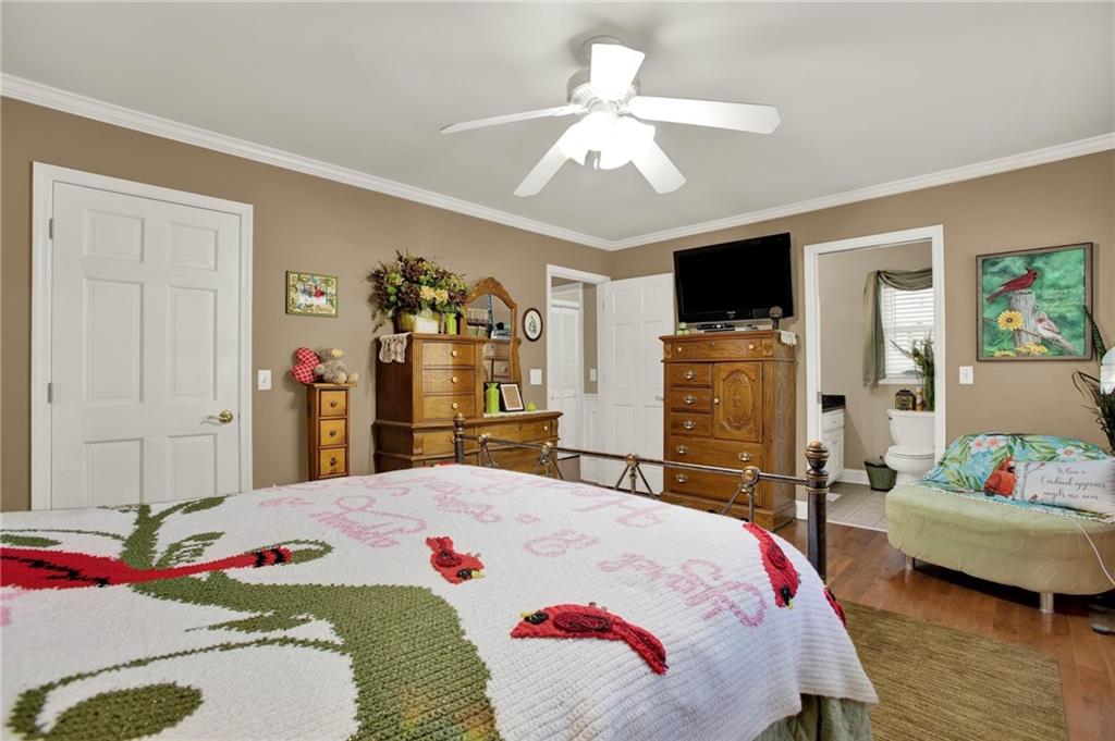 103 Mims Drive Calhoun, GA 30701 - Photo 17 of 34 a bedroom that has a bed and a flat screen tv