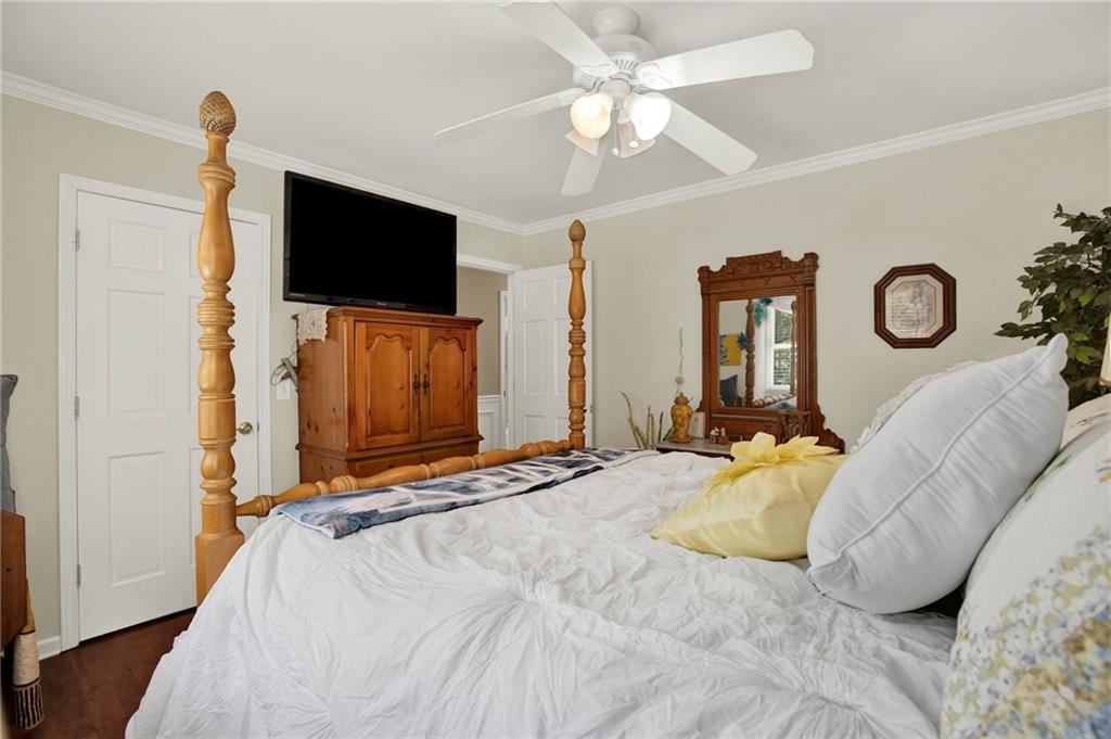 103 Mims Drive Calhoun, GA 30701 - Photo 23 of 34 a bedroom with a bed and a flat screen tv