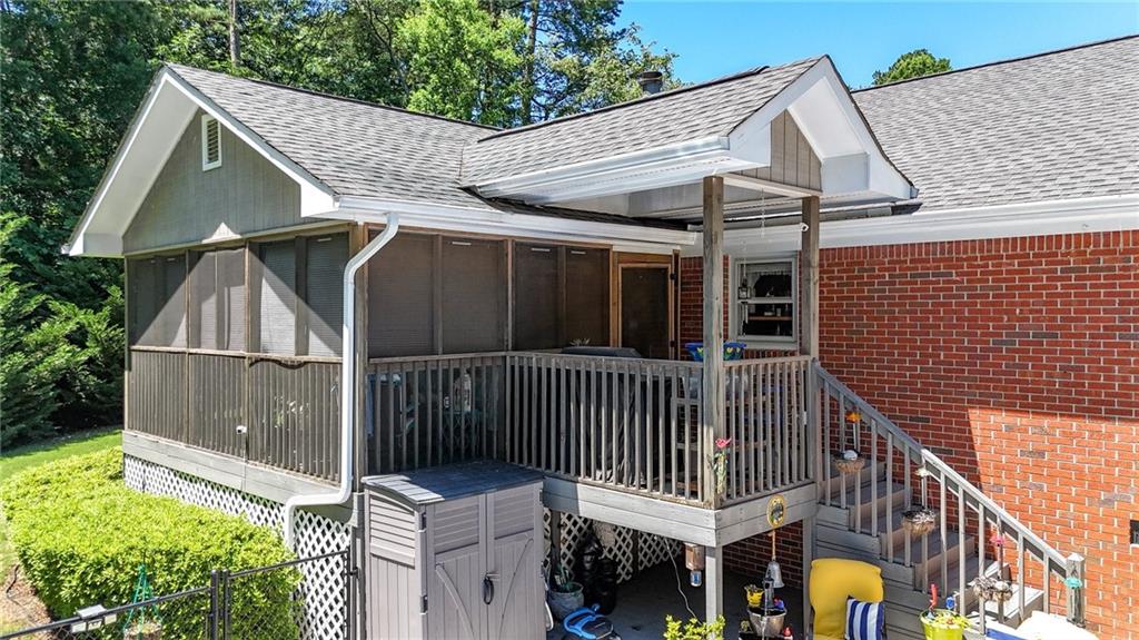 103 Mims Drive Calhoun, GA 30701 - Photo 32 of 34 a view of a small house with wooden deck and furniture