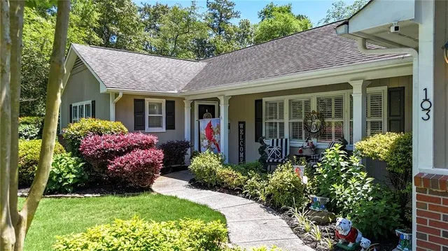 a view of a house with potted plants