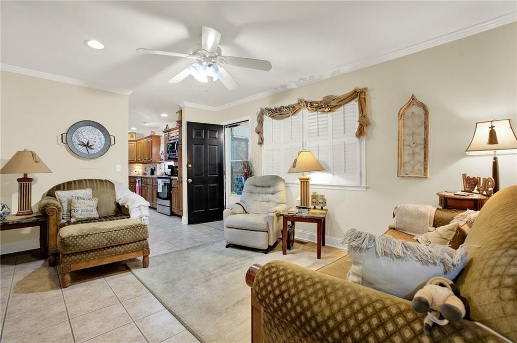 103 Mims Drive Calhoun, GA 30701 - Photo 6 of 34 a living room with furniture and a large window