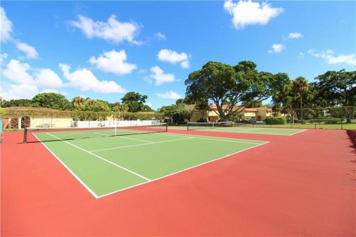 906 Southwest 9th St Circle, Unit 106 Boca Raton, FL 33486 - Photo 25 of 26 a view of a tennis court