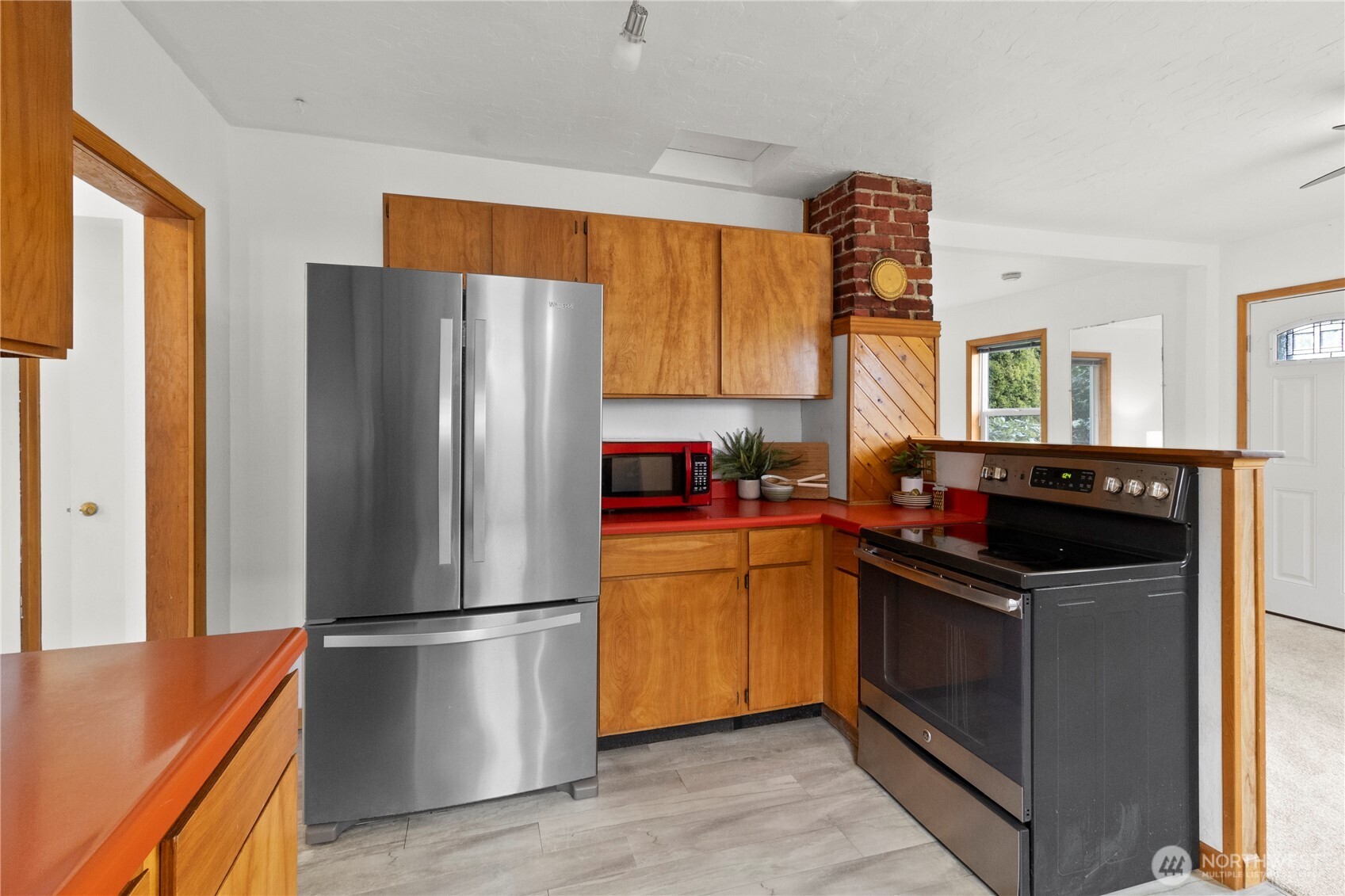 2431 Franklin Street Bellingham, WA 98225 - Photo 8 of 26 a kitchen with stainless steel appliances granite countertop a refrigerator a sink a stove and a refrigerator
