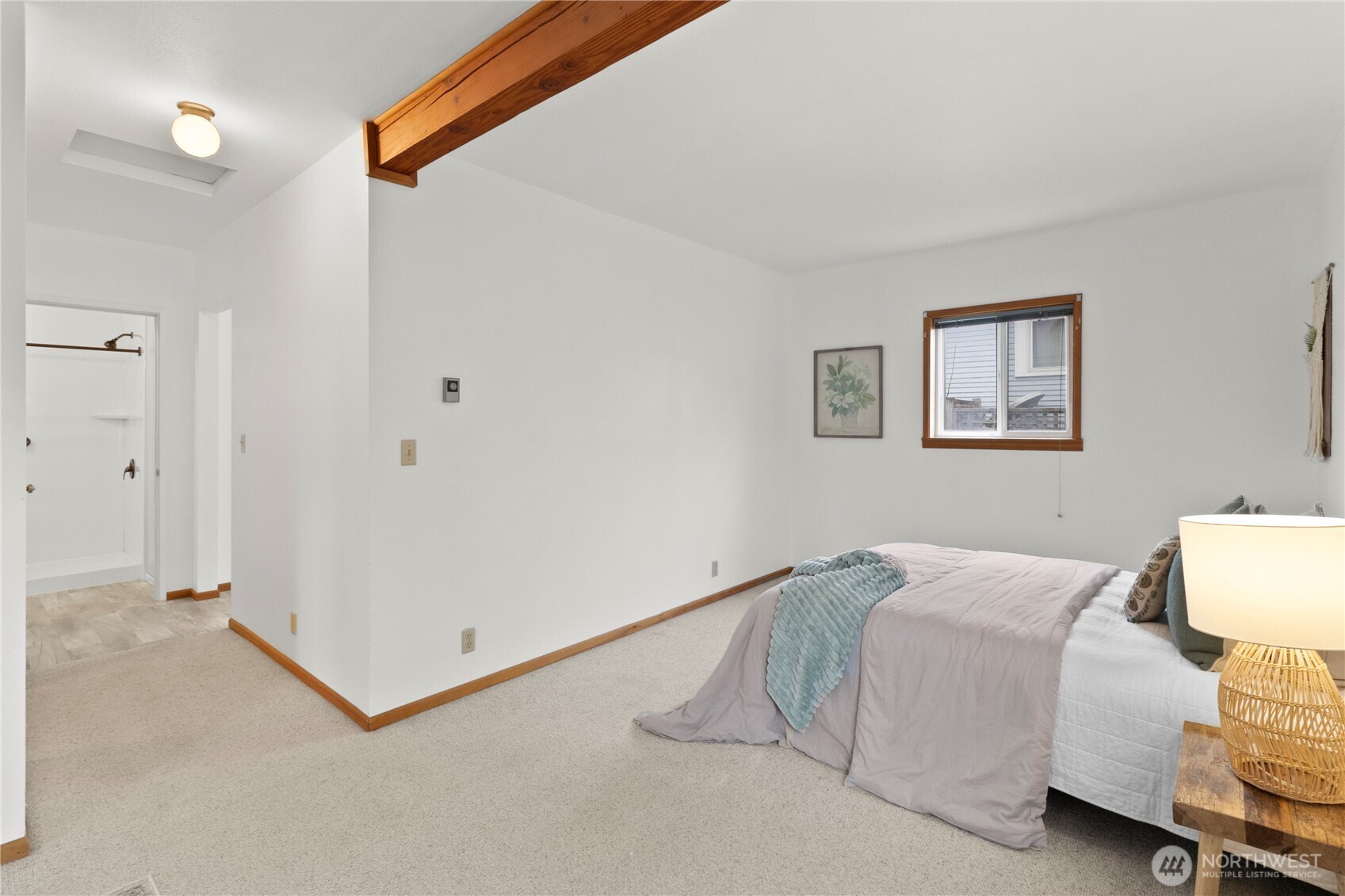 2431 Franklin Street Bellingham, WA 98225 - Photo 10 of 26 a bedroom with a bed and a lamp