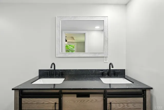 a view of a sink and cabinets