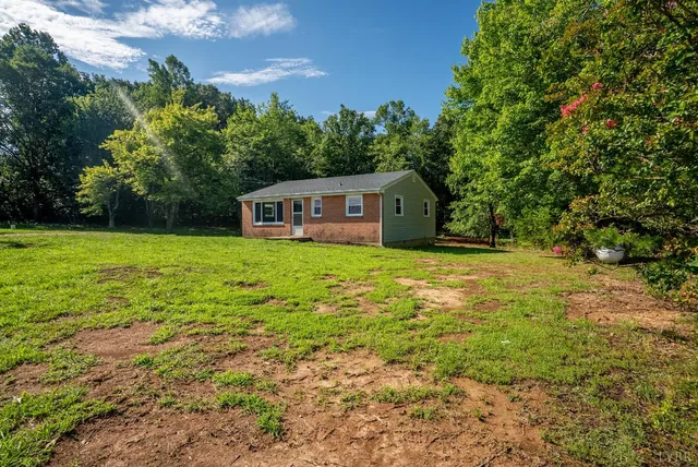 a view of a house with a big yard