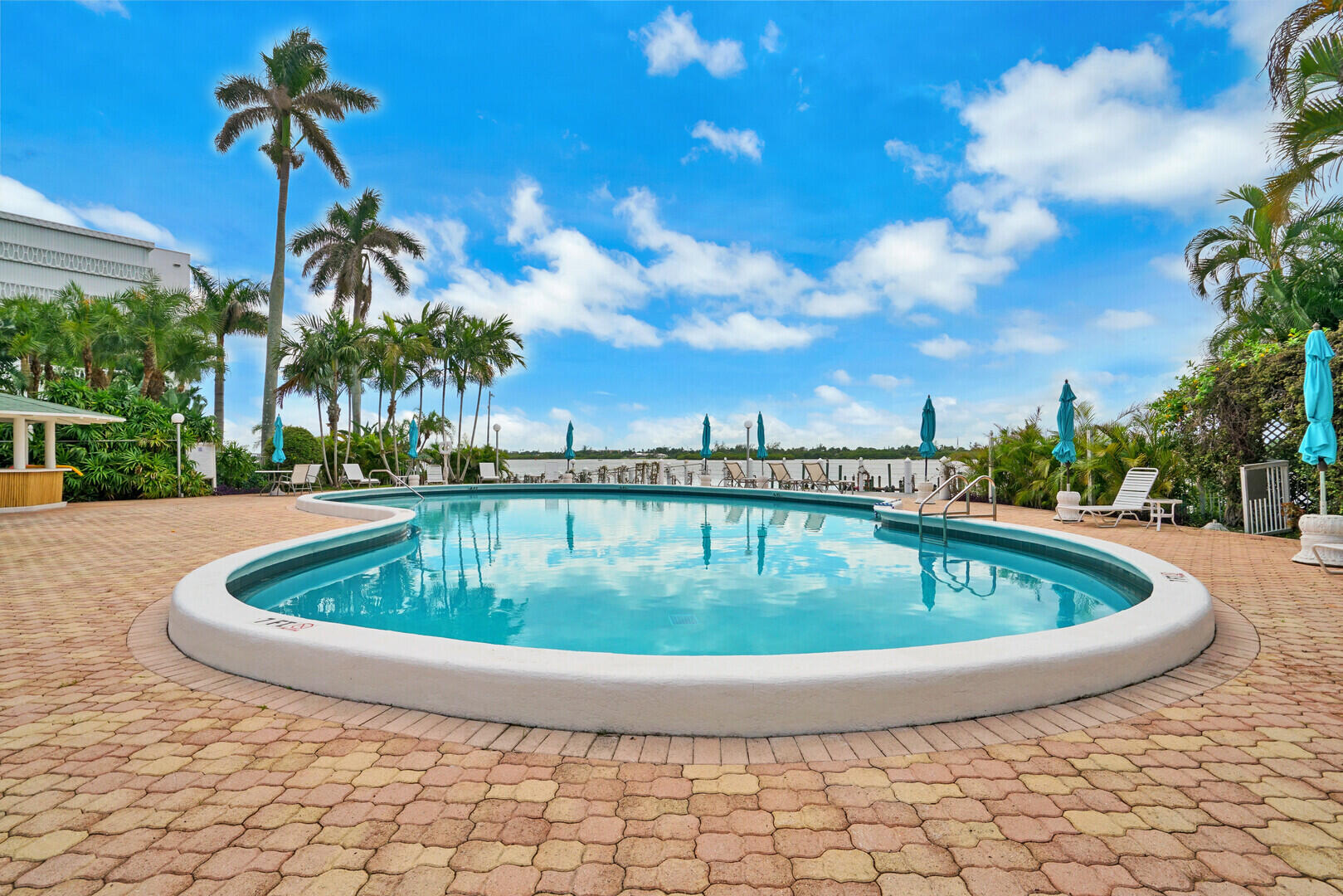 2505 South Ocean Boulevard, Unit 601 Palm Beach, FL 33480 - Photo 28 of 56 a view of a swimming pool with a yard