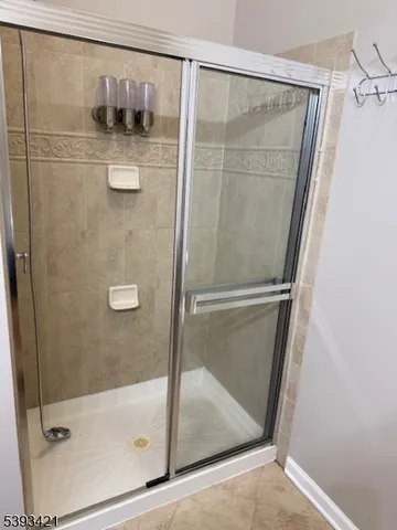 an empty room with wooden floor & closet and door