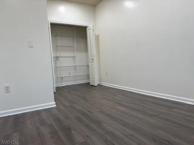 a view of door with wooden floor