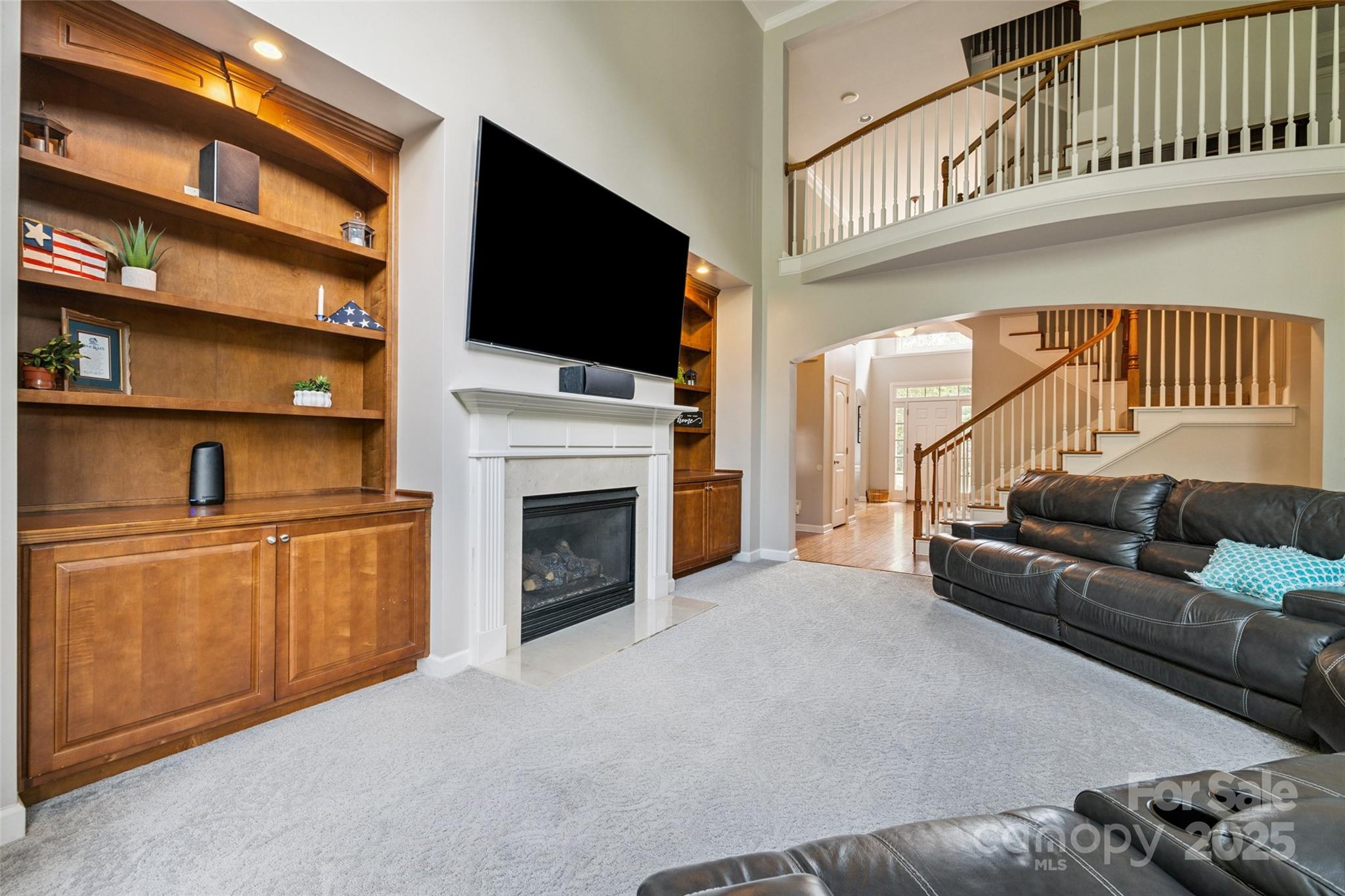 9142 Drayton Lane Indian Land, SC 29707 - Photo 13 of 48 a living room with fireplace furniture and a flat screen tv