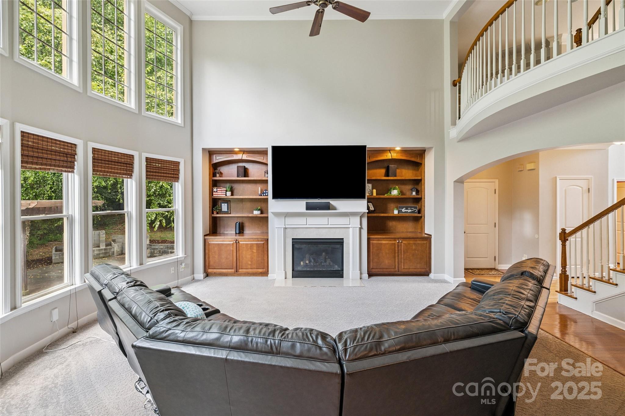 9142 Drayton Lane Indian Land, SC 29707 - Photo 14 of 48 a living room with furniture a flat screen tv and a fireplace