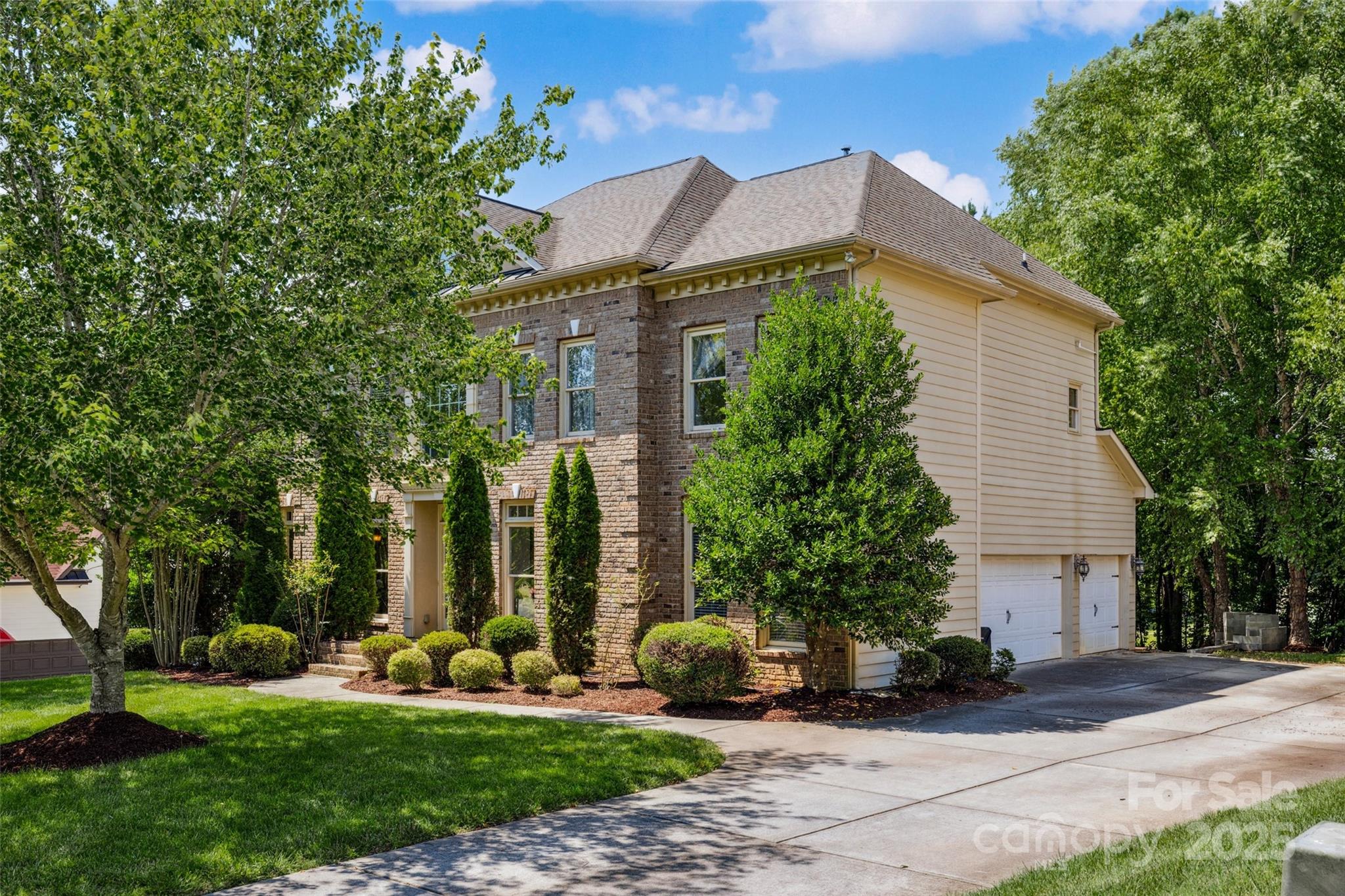 9142 Drayton Lane Indian Land, SC 29707 - Photo 2 of 48 a front view of a house with a yard and potted plants