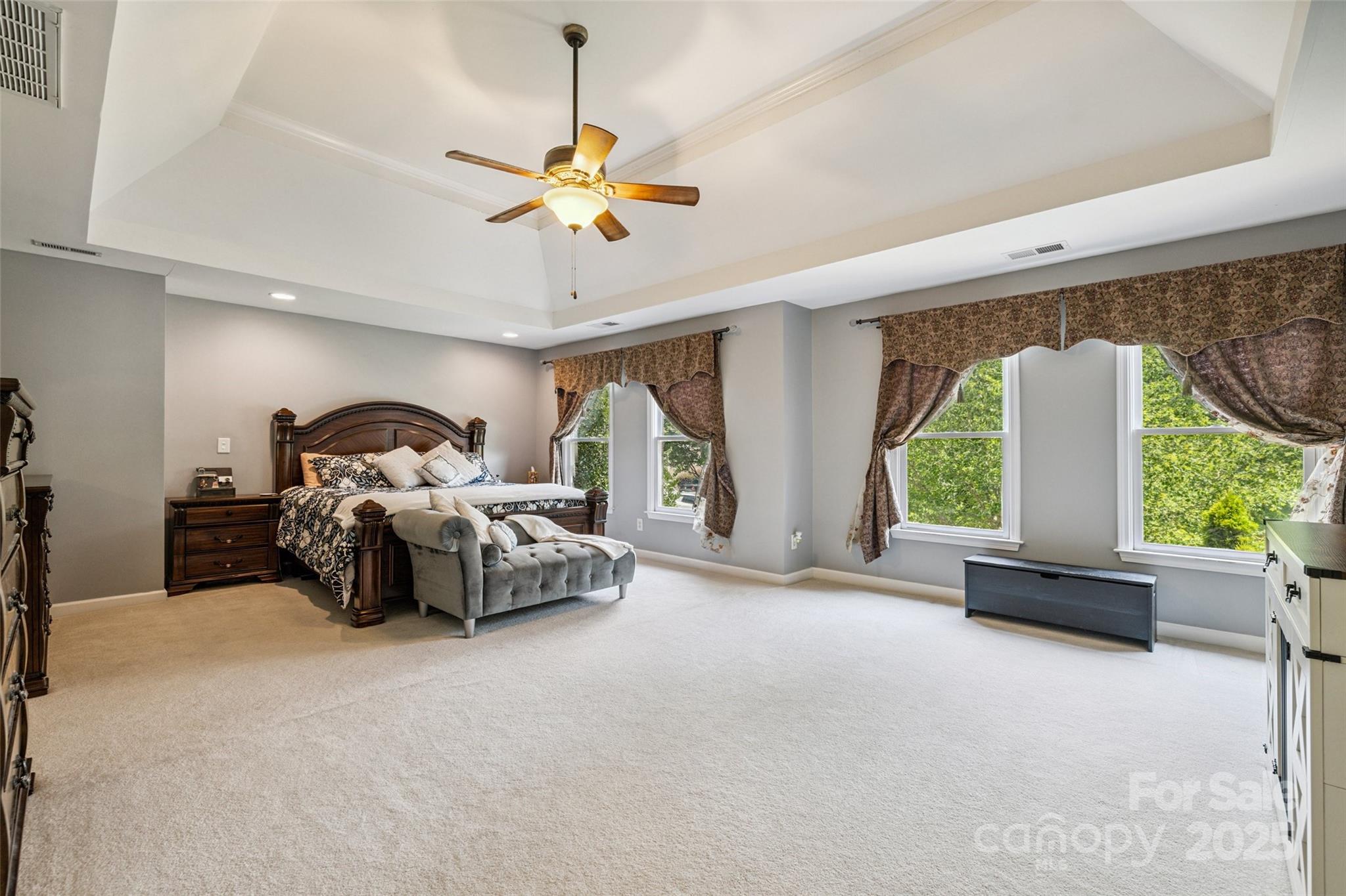 9142 Drayton Lane Indian Land, SC 29707 - Photo 22 of 48 a bedroom with a bed and a chandelier