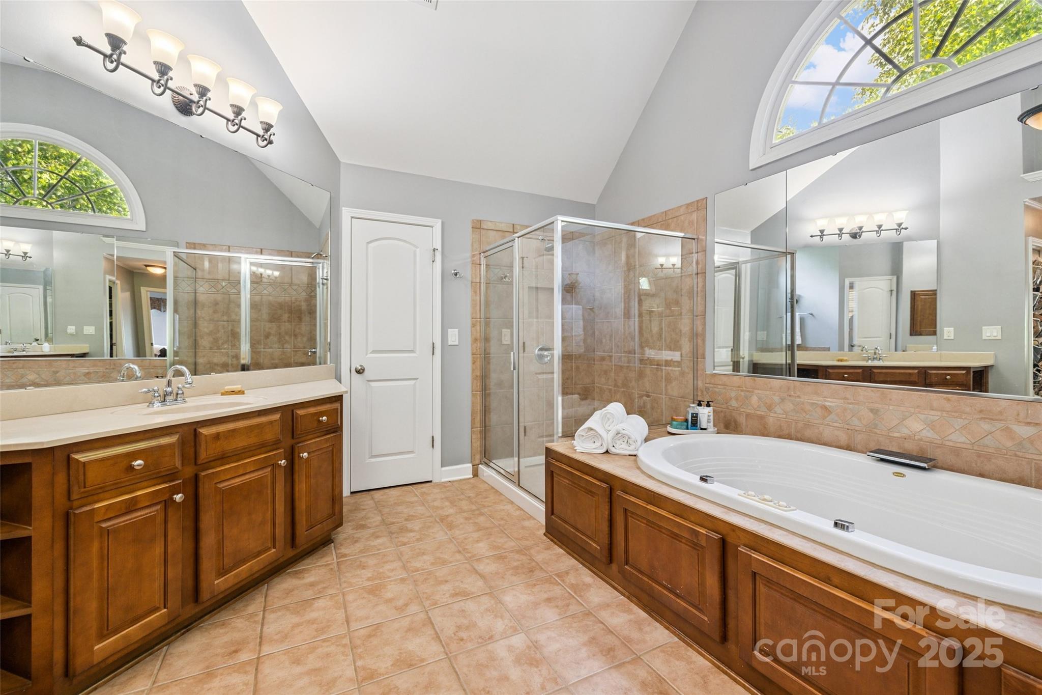 9142 Drayton Lane Indian Land, SC 29707 - Photo 27 of 48 a large spacious bathroom with a granite countertop tub double vanity and a large mirror