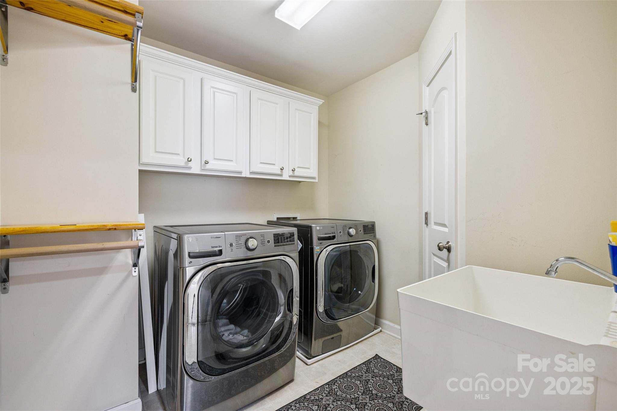 9142 Drayton Lane Indian Land, SC 29707 - Photo 29 of 48 a utility room with sink dryer and washer