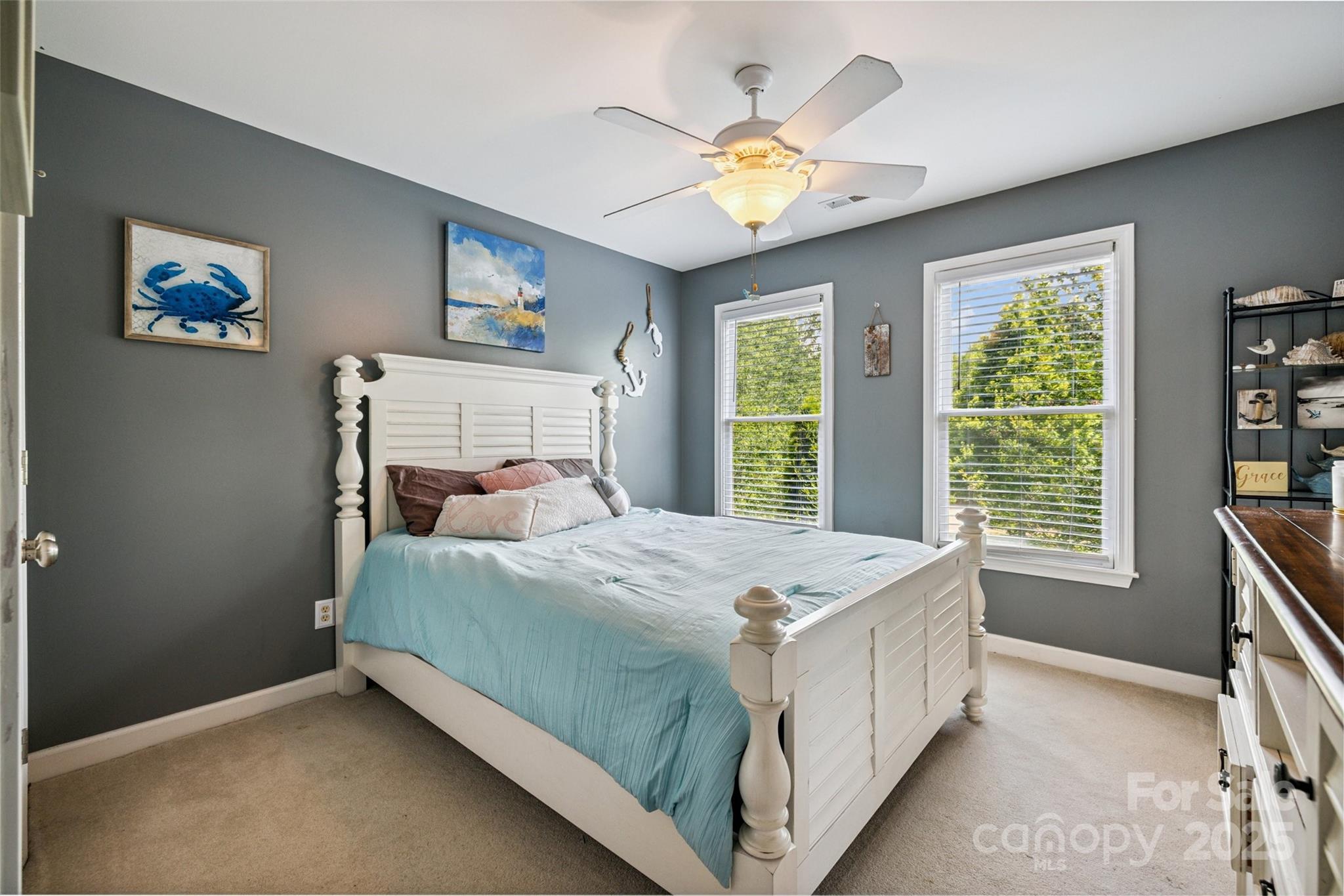9142 Drayton Lane Indian Land, SC 29707 - Photo 35 of 48 a bedroom with a bed and a chandelier