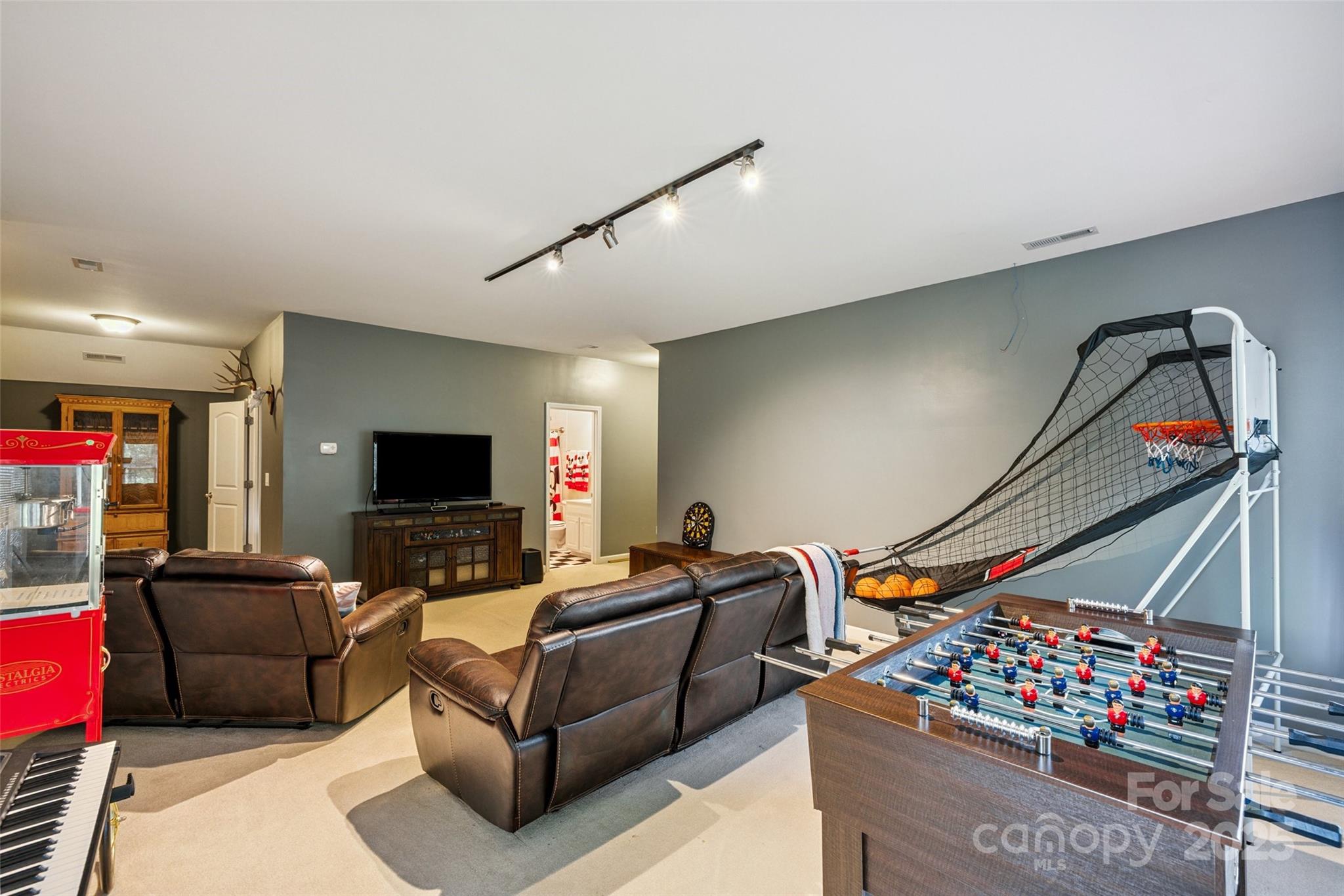 9142 Drayton Lane Indian Land, SC 29707 - Photo 40 of 48 a living room with furniture a flat screen tv and a couch