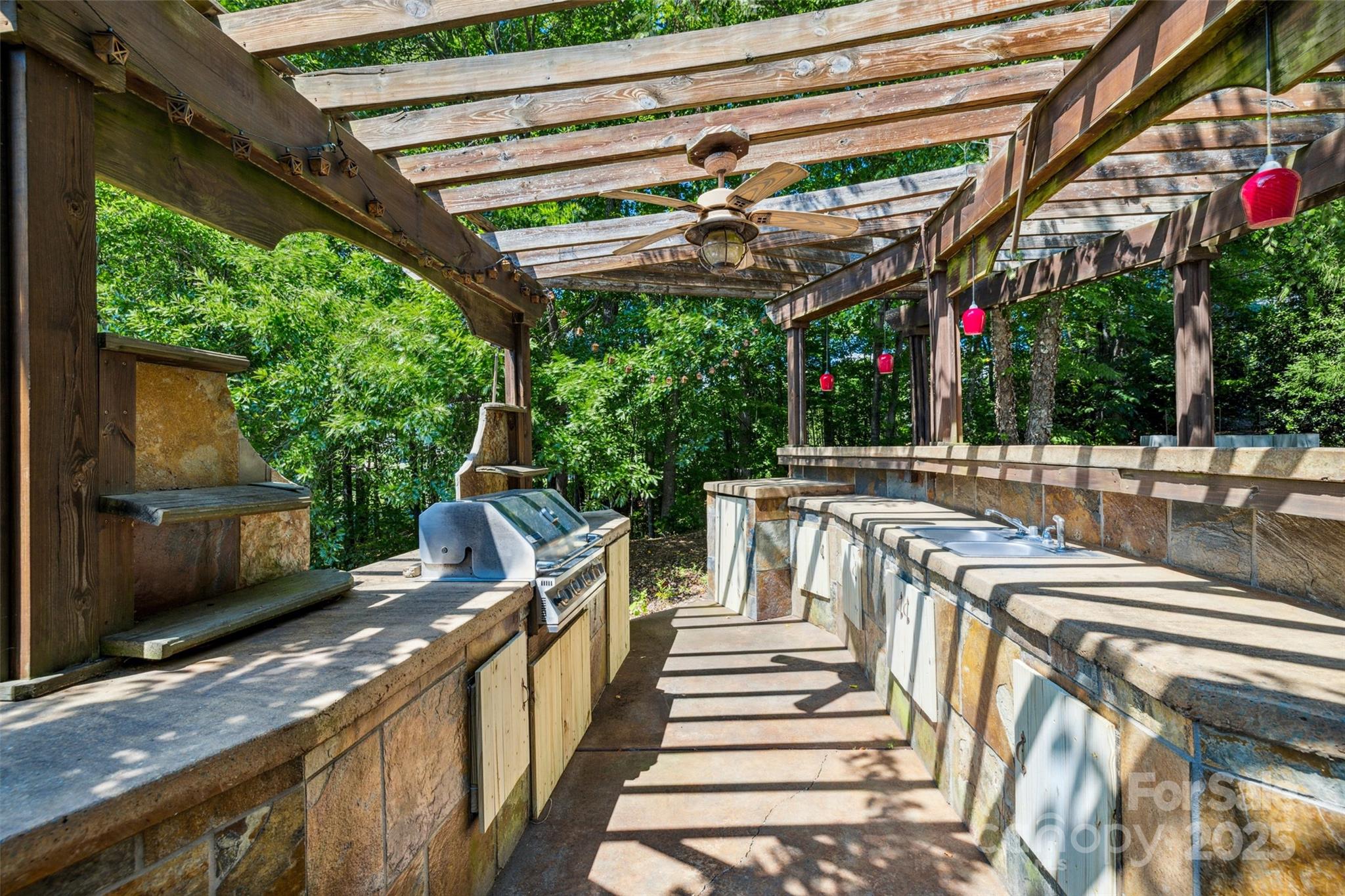 9142 Drayton Lane Indian Land, SC 29707 - Photo 44 of 48 a view of a patio with a table and chairs and a barbeque