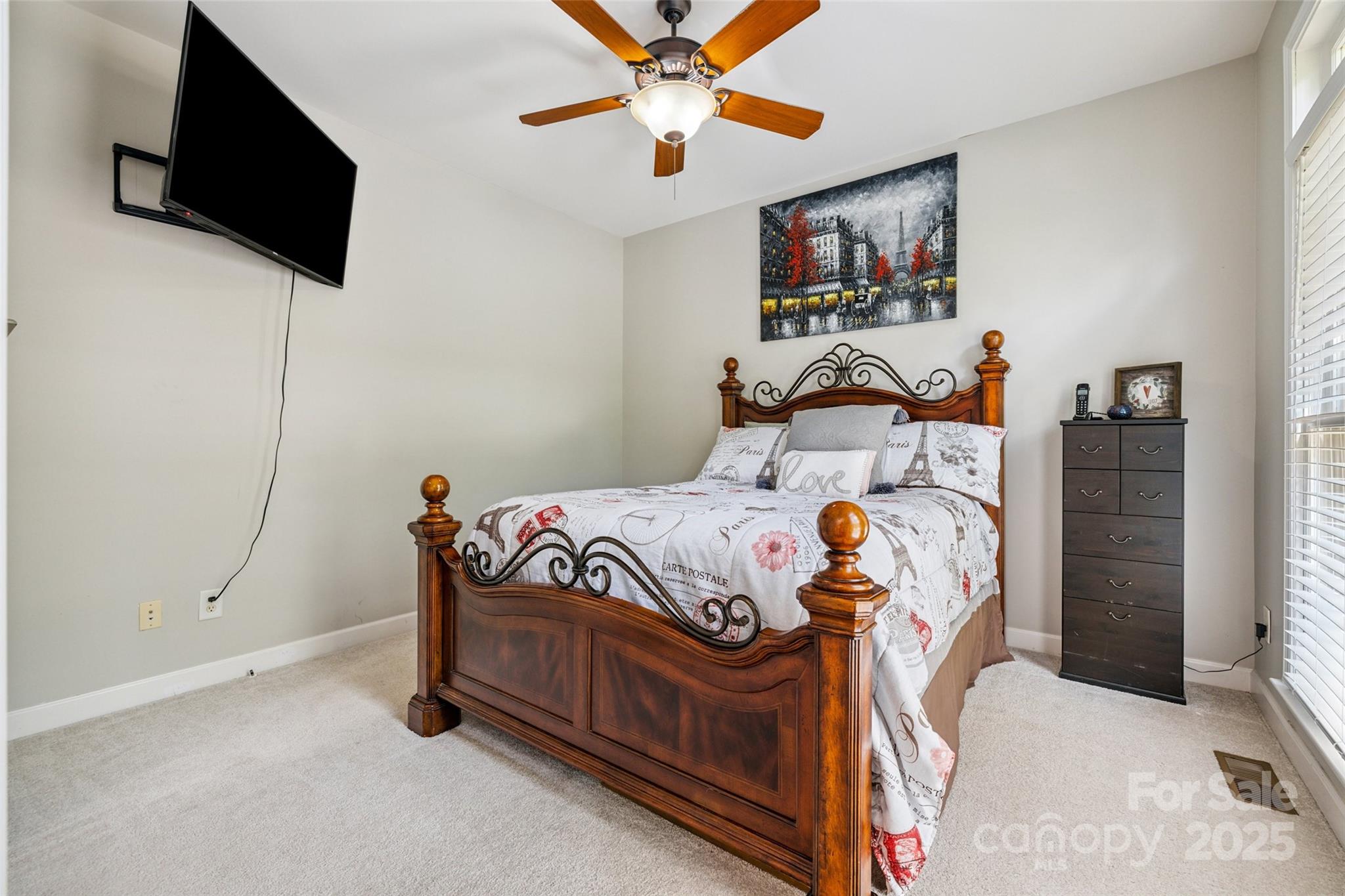 9142 Drayton Lane Indian Land, SC 29707 - Photo 9 of 48 a bedroom with a bed and a flat screen tv