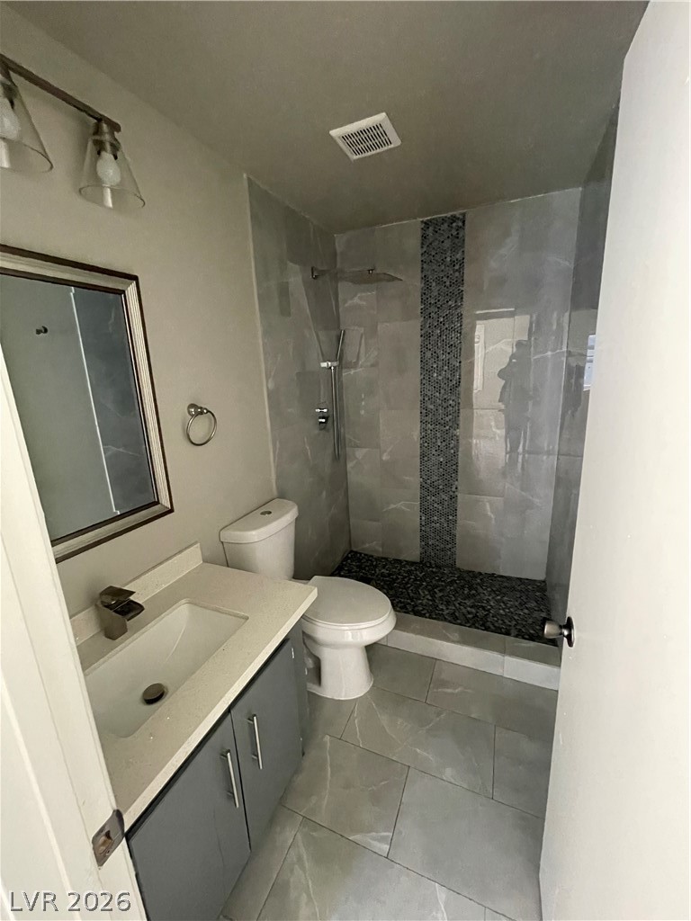 466 East Sunset Road, Unit D Henderson, NV 89011 - Photo 15 of 20 Bathroom with vanity and a stall shower