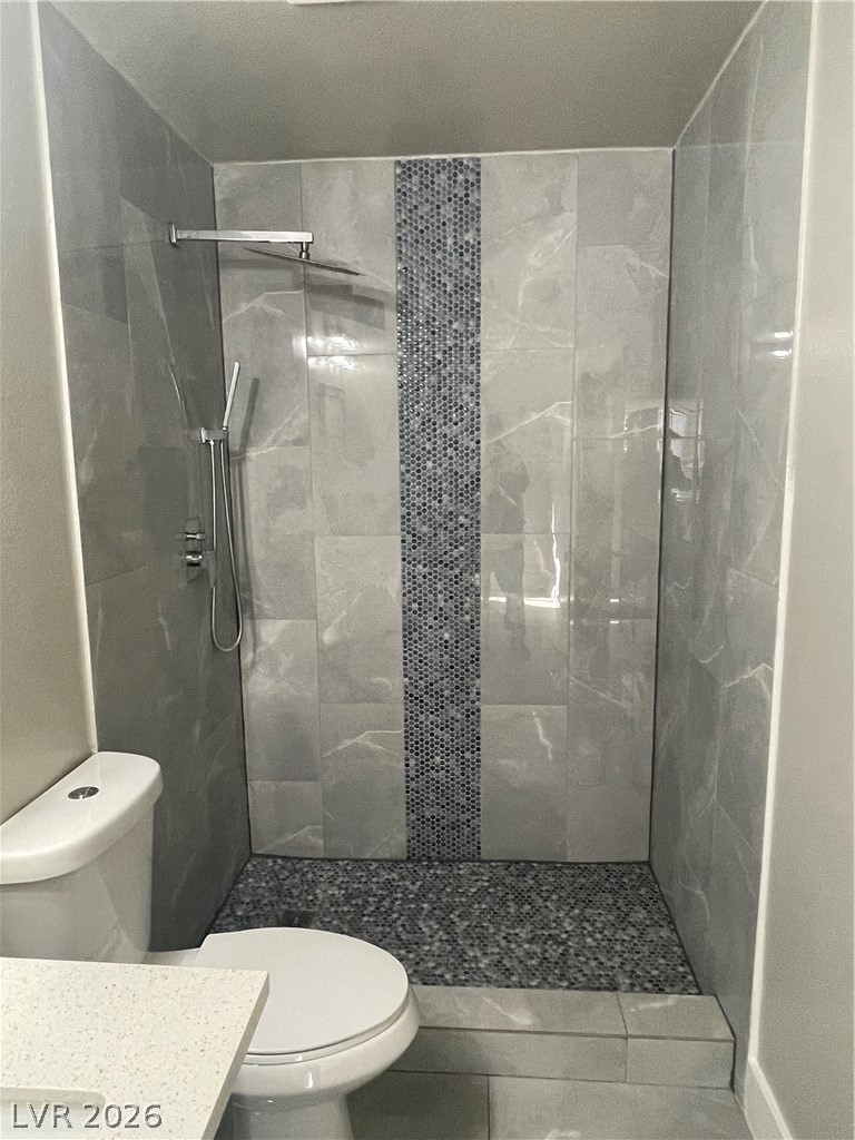 466 East Sunset Road, Unit D Henderson, NV 89011 - Photo 18 of 20 Full bathroom with vanity, a stall shower, and tile patterned flooring
