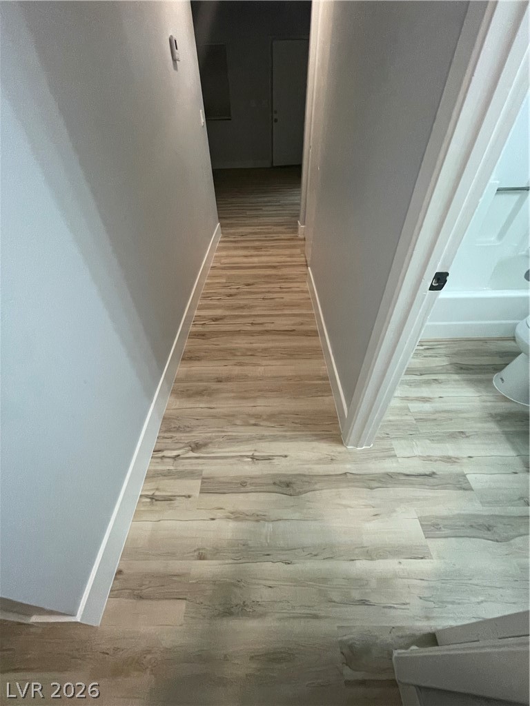 466 East Sunset Road, Unit D Henderson, NV 89011 - Photo 10 of 20 Corridor with light wood-style floors and baseboards