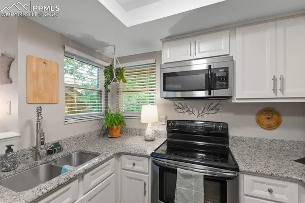a kitchen with a stove and a sink
