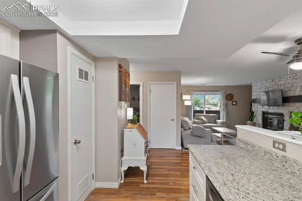 a view of living room with furniture and wooden floor
