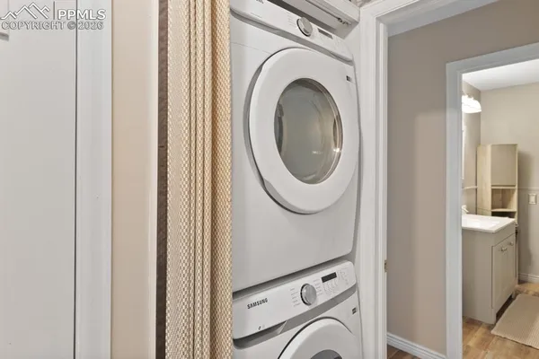 a view of a hallway with washer and dryer