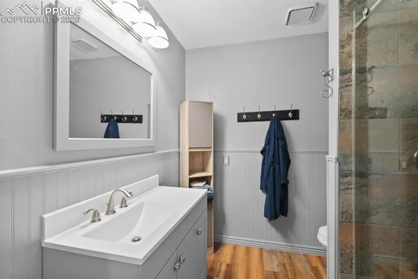 a bathroom with a sink and mirror