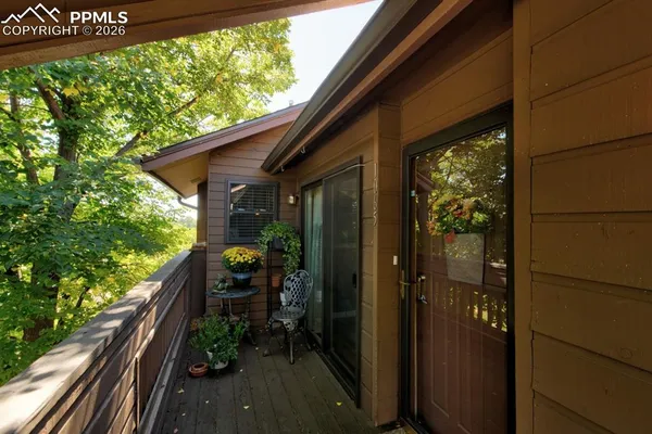 a view of balcony with furniture